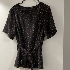 New- never worn black top with flower print.